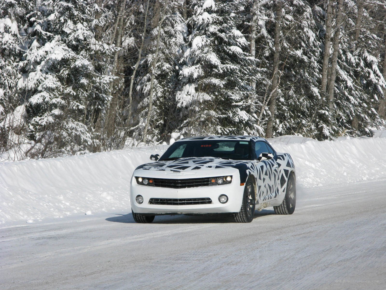 White car on snowy road