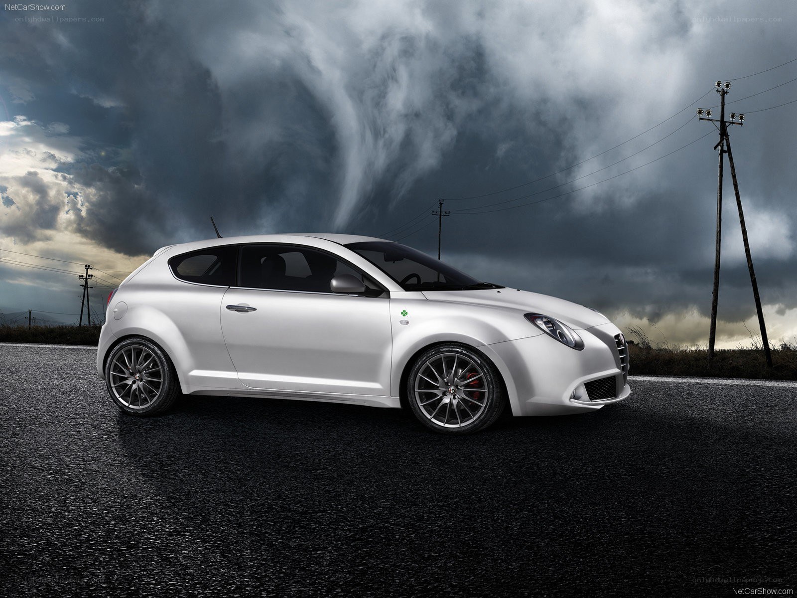 white car on stormy road