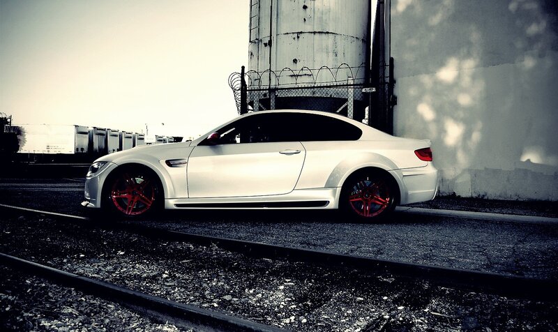 white car on train tracks