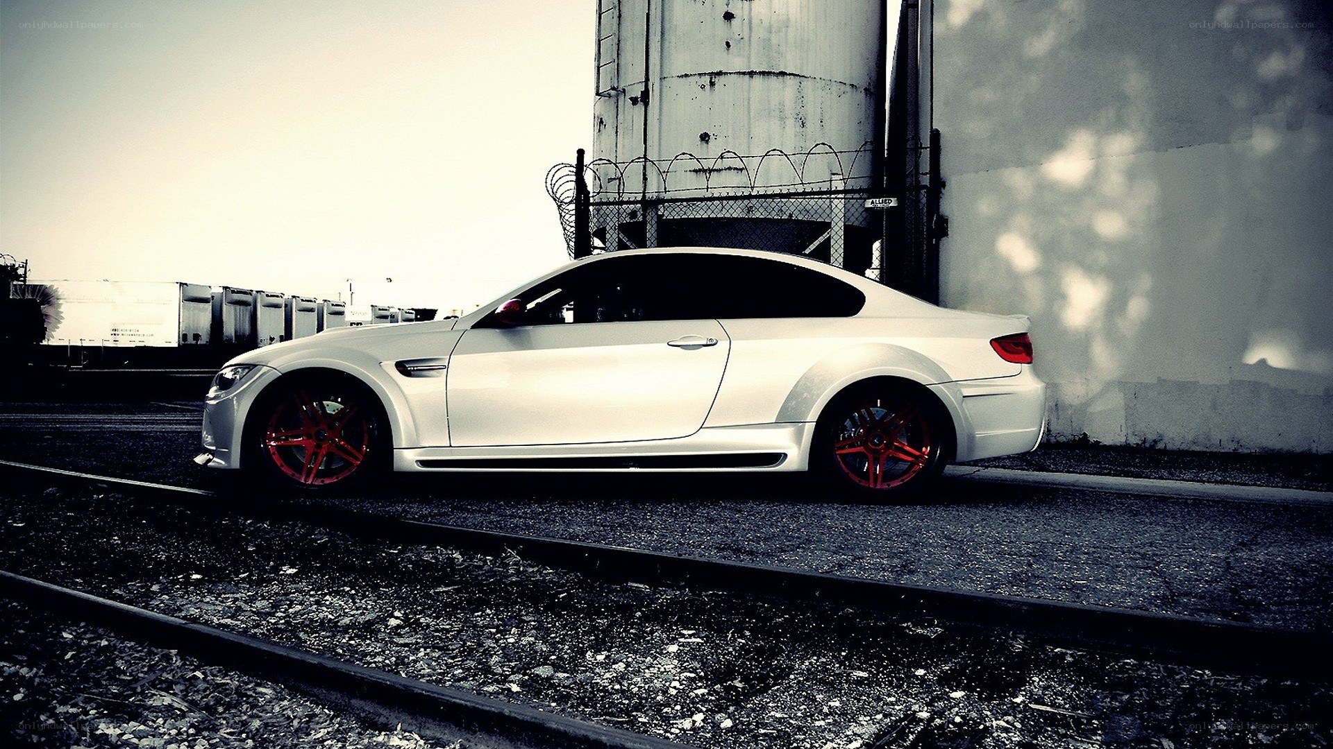 white car on train tracks