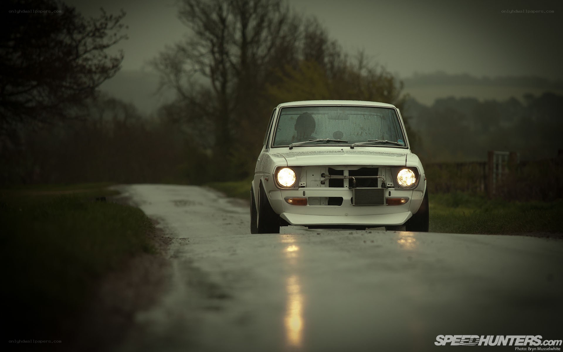 white car on wet road