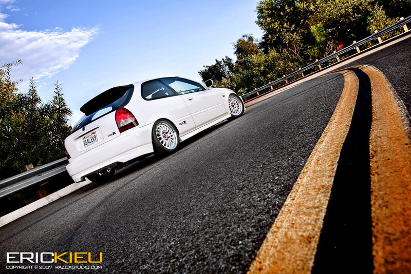 white car on winding road