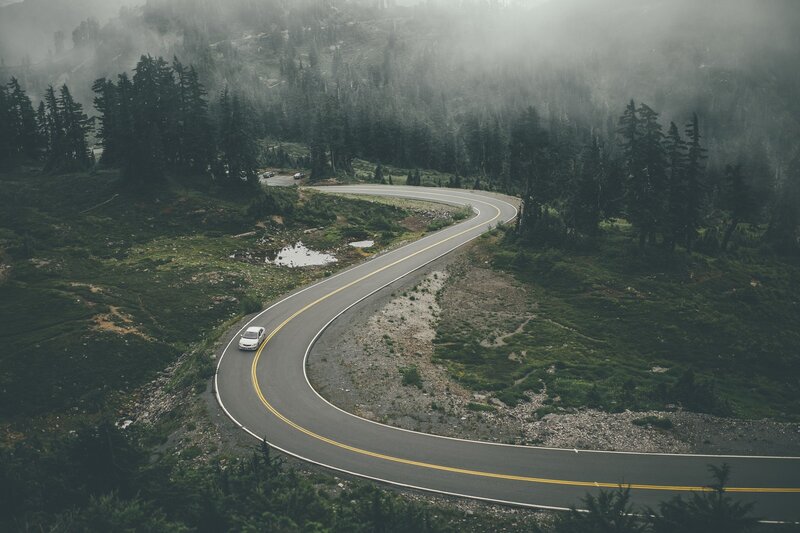 White Car on Winding Road — Green