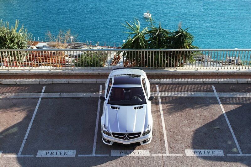 White car parked by the sea