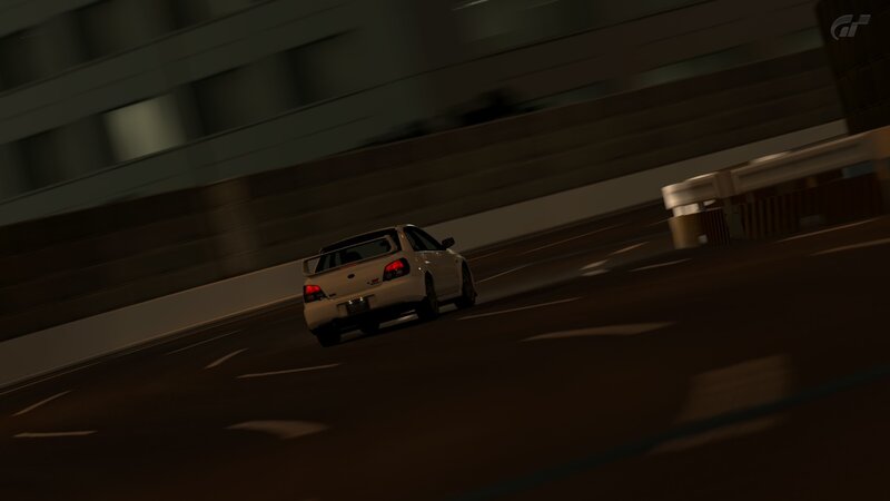white car racing at night