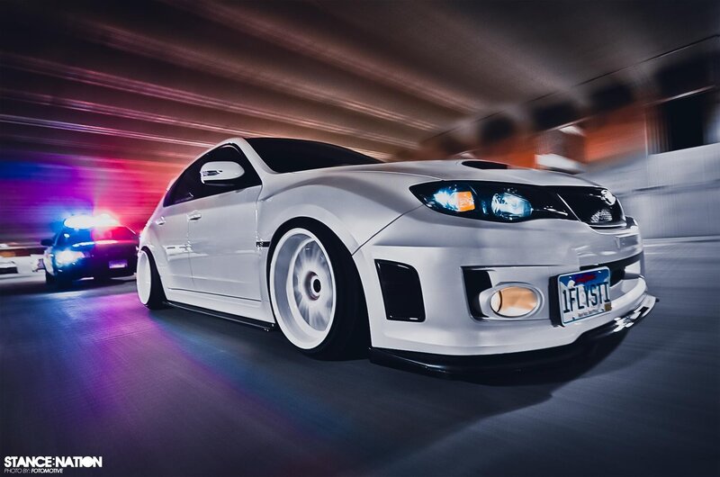 white car racing at night