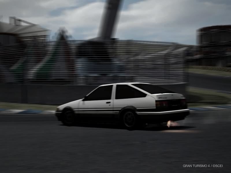 white car racing on track
