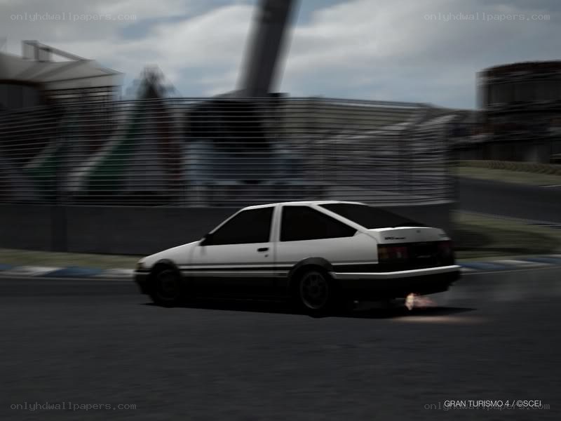 white car racing on track