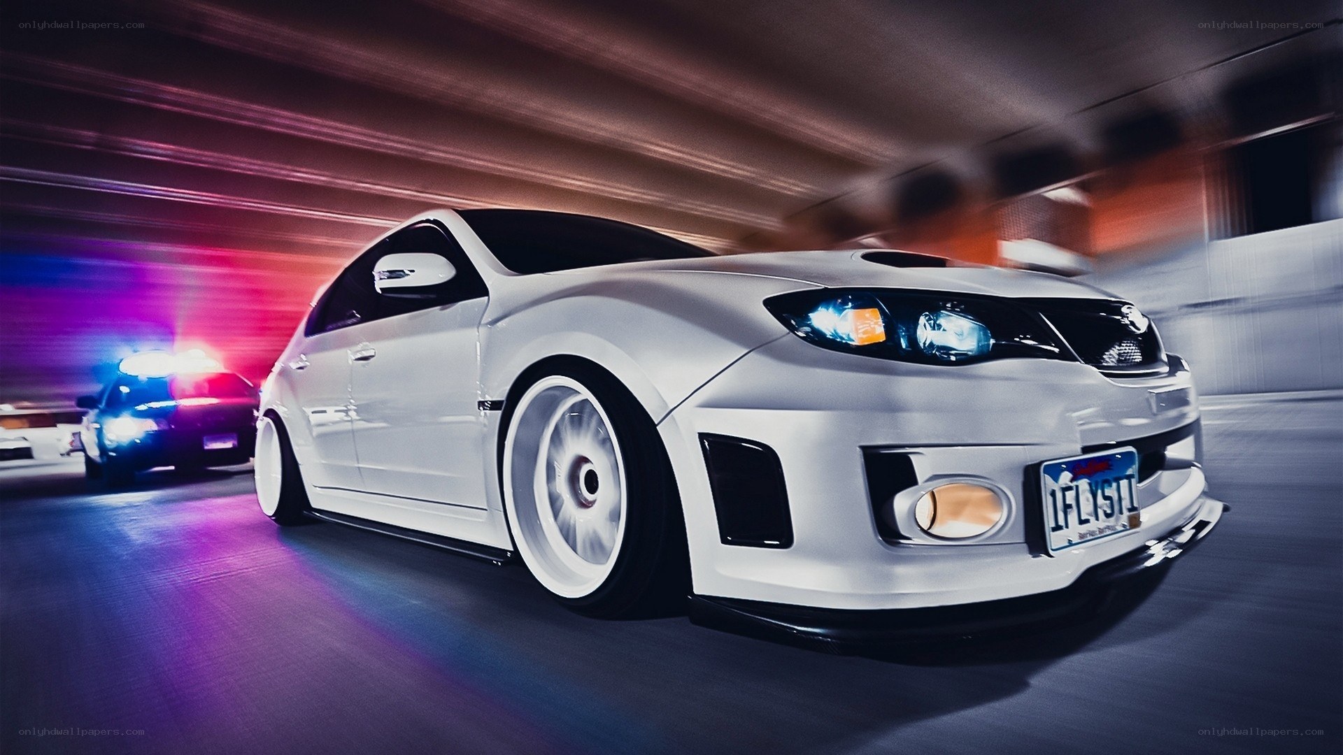 white car speeding in tunnel