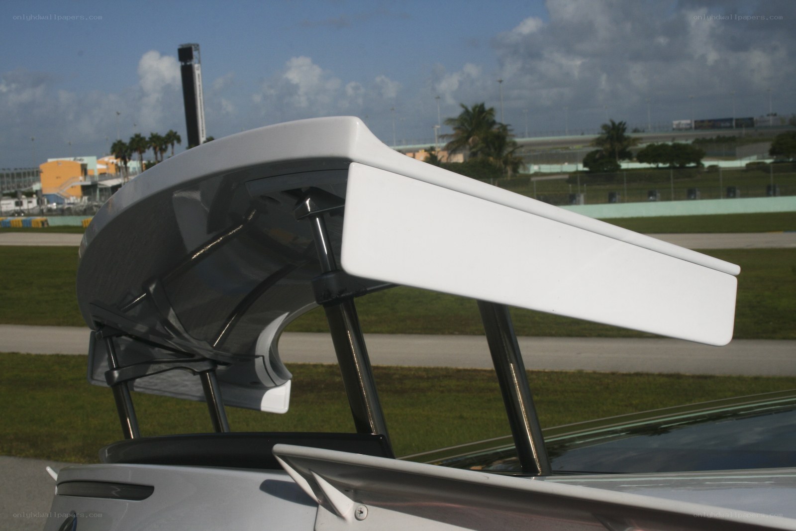 white car spoiler at racetrack