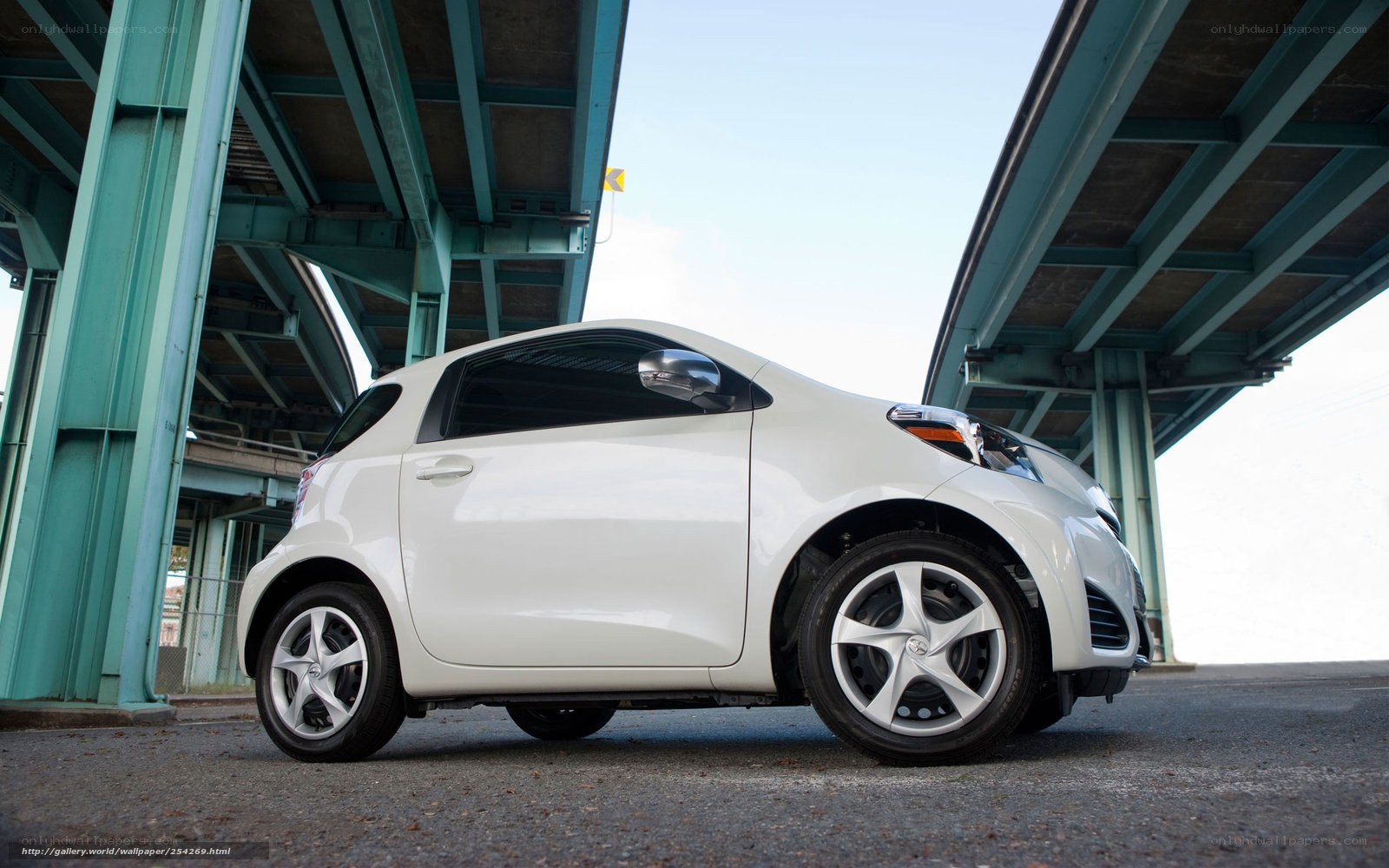 White car under a bridge