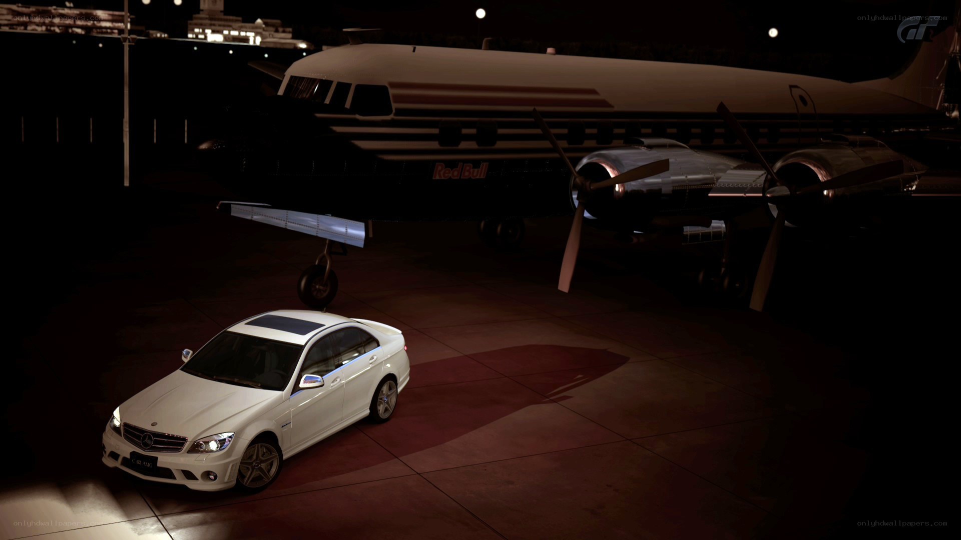 White car under airplane at night