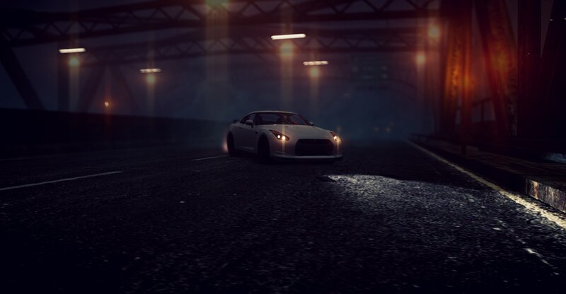 white car under bridge at night