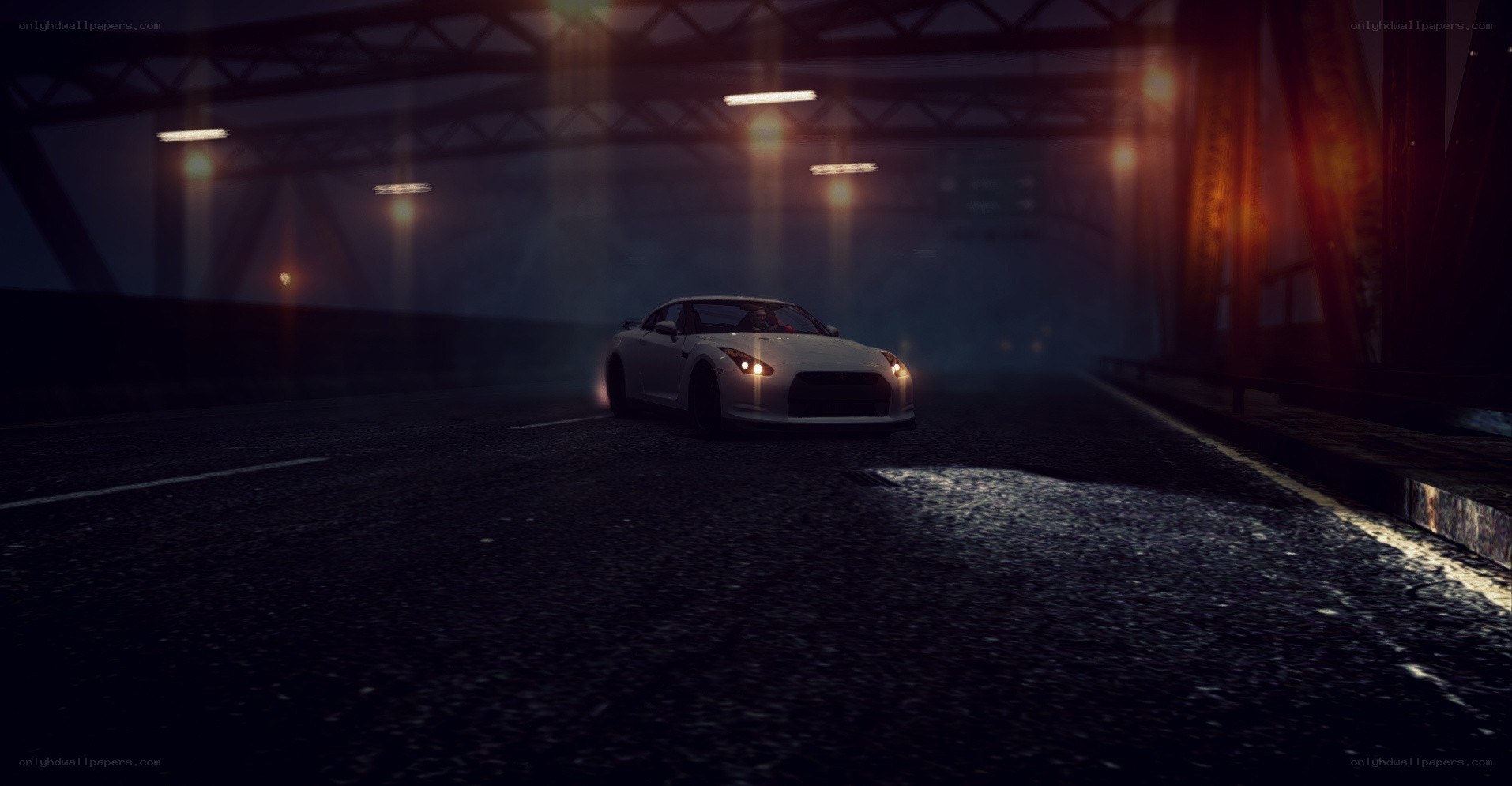 white car under bridge at night