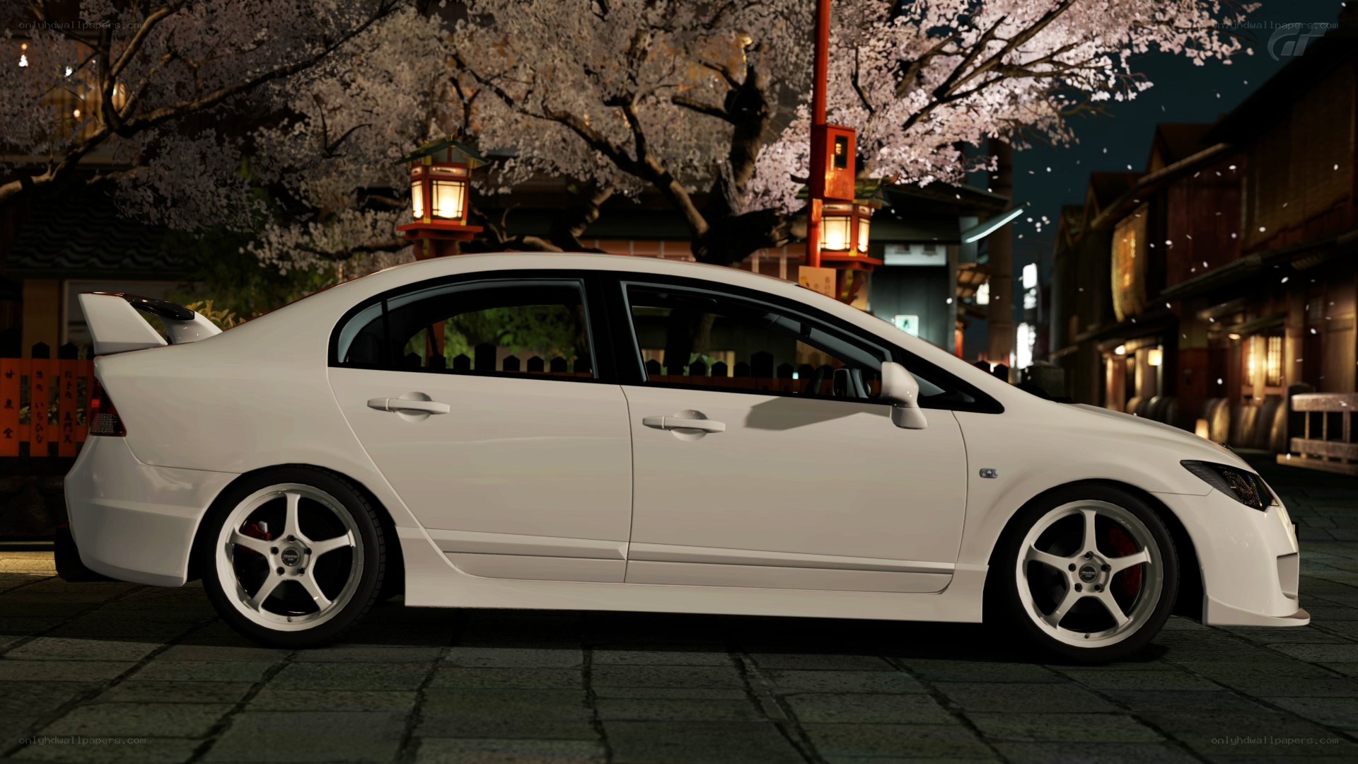 White car under cherry blossoms