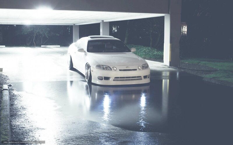 white car under parking garage