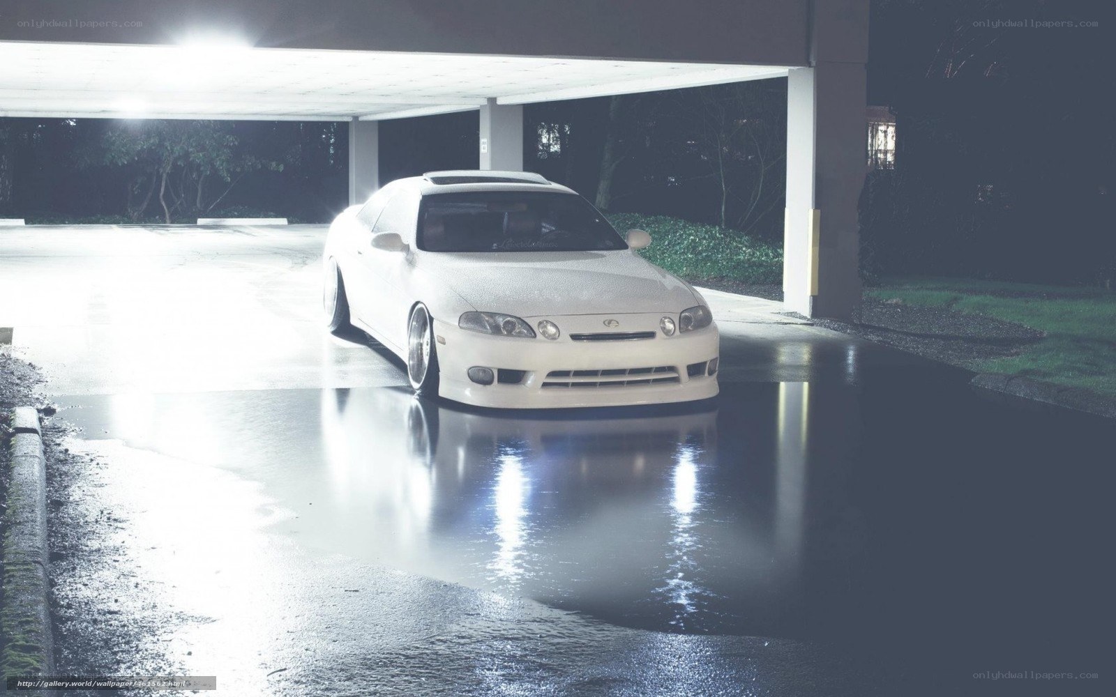 white car under parking garage
