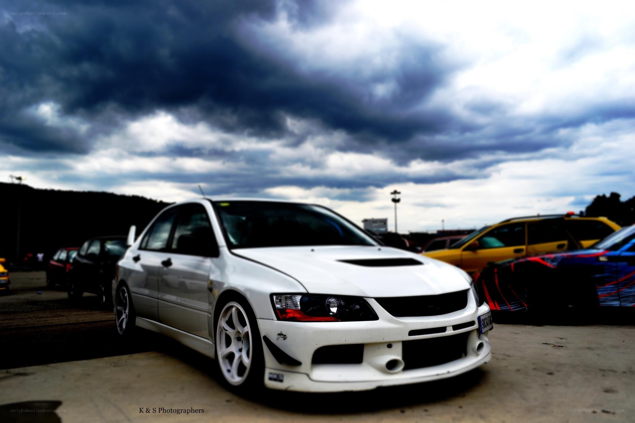 White car under stormy sky