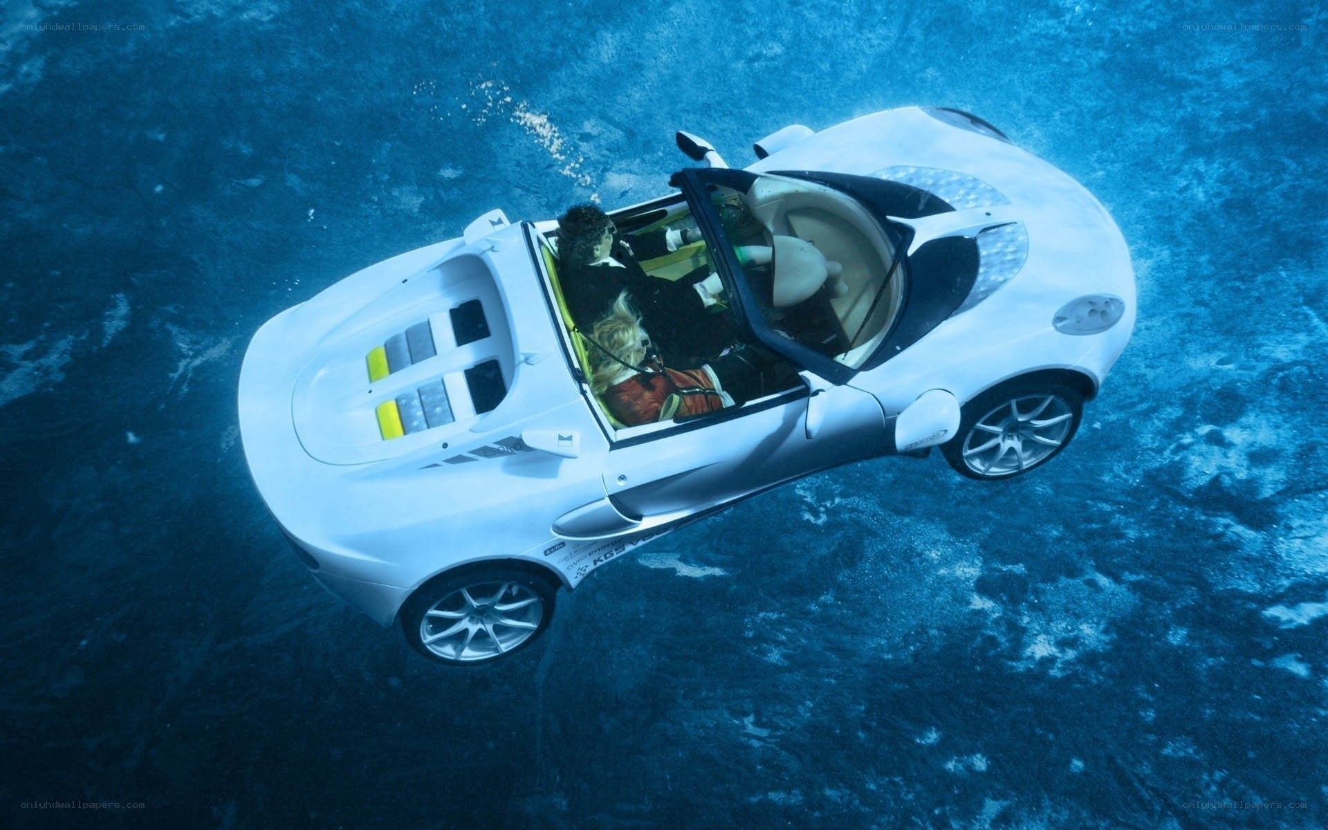 White car underwater with passengers
