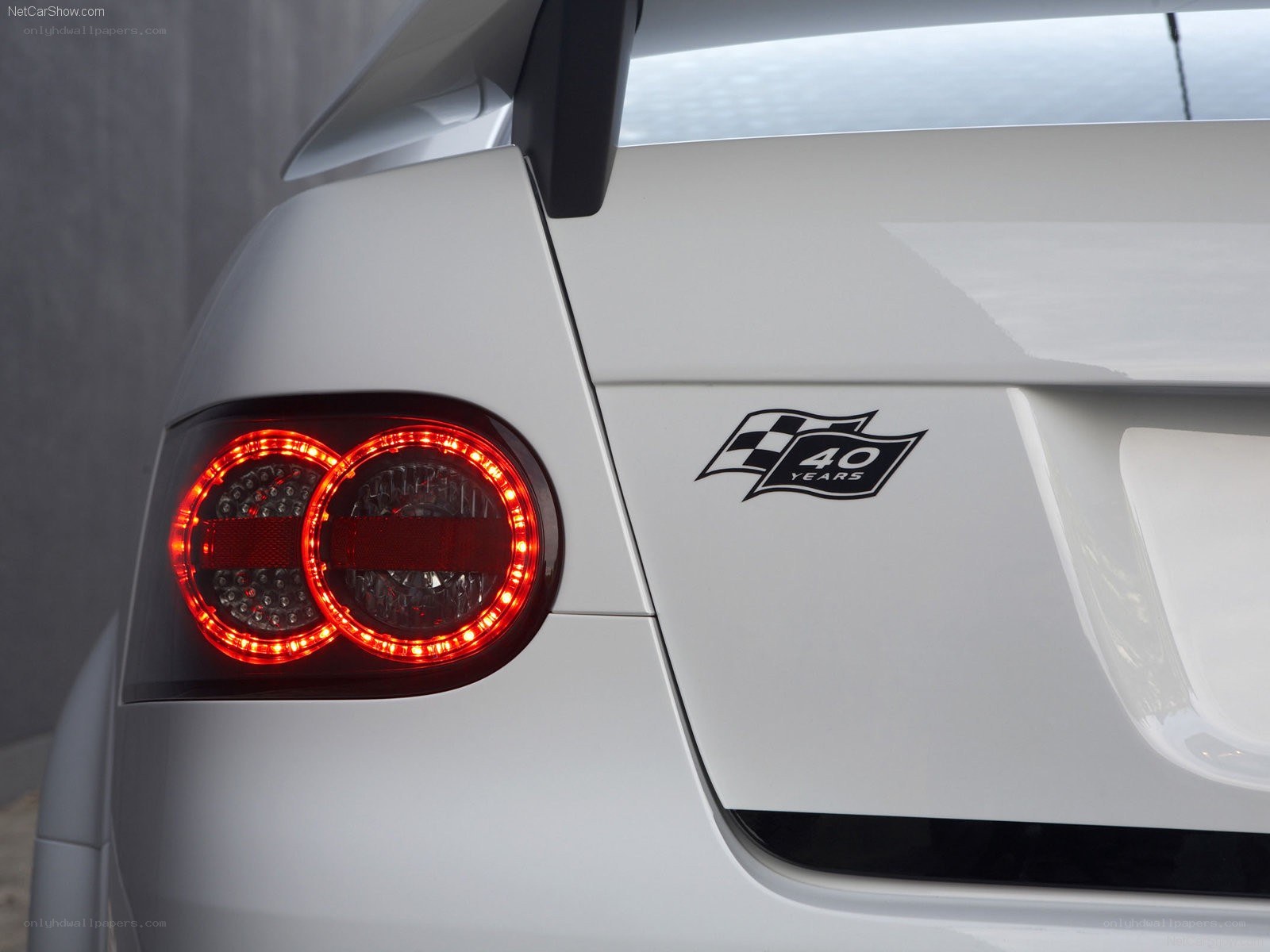 white car with 40 years badge