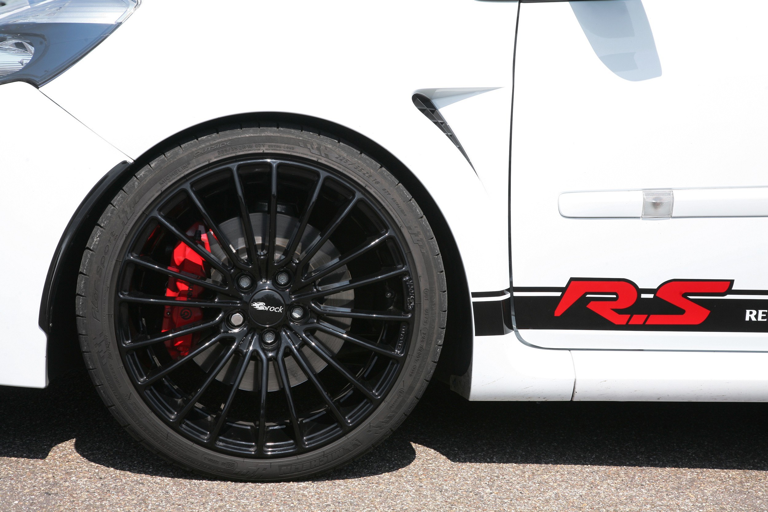white car with black wheels