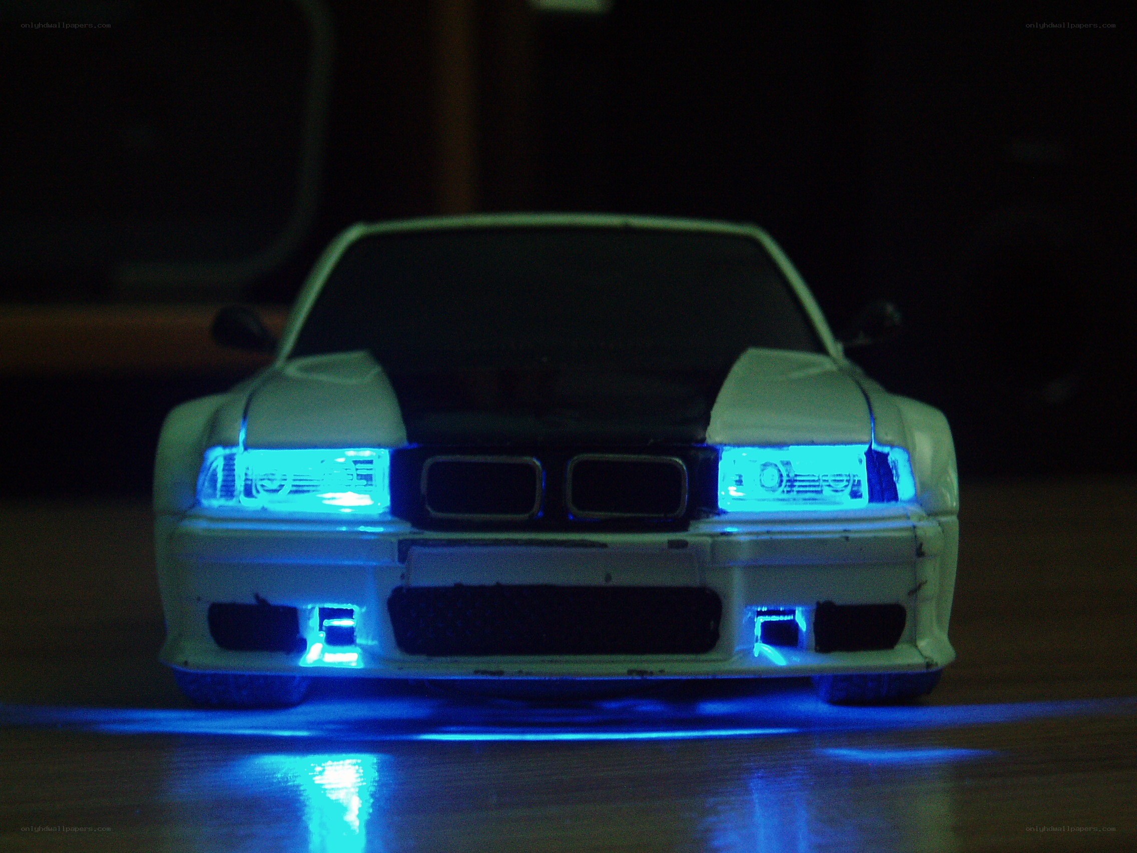 white car with blue lights