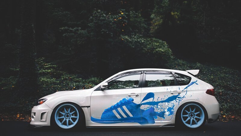 white car with blue shoe art