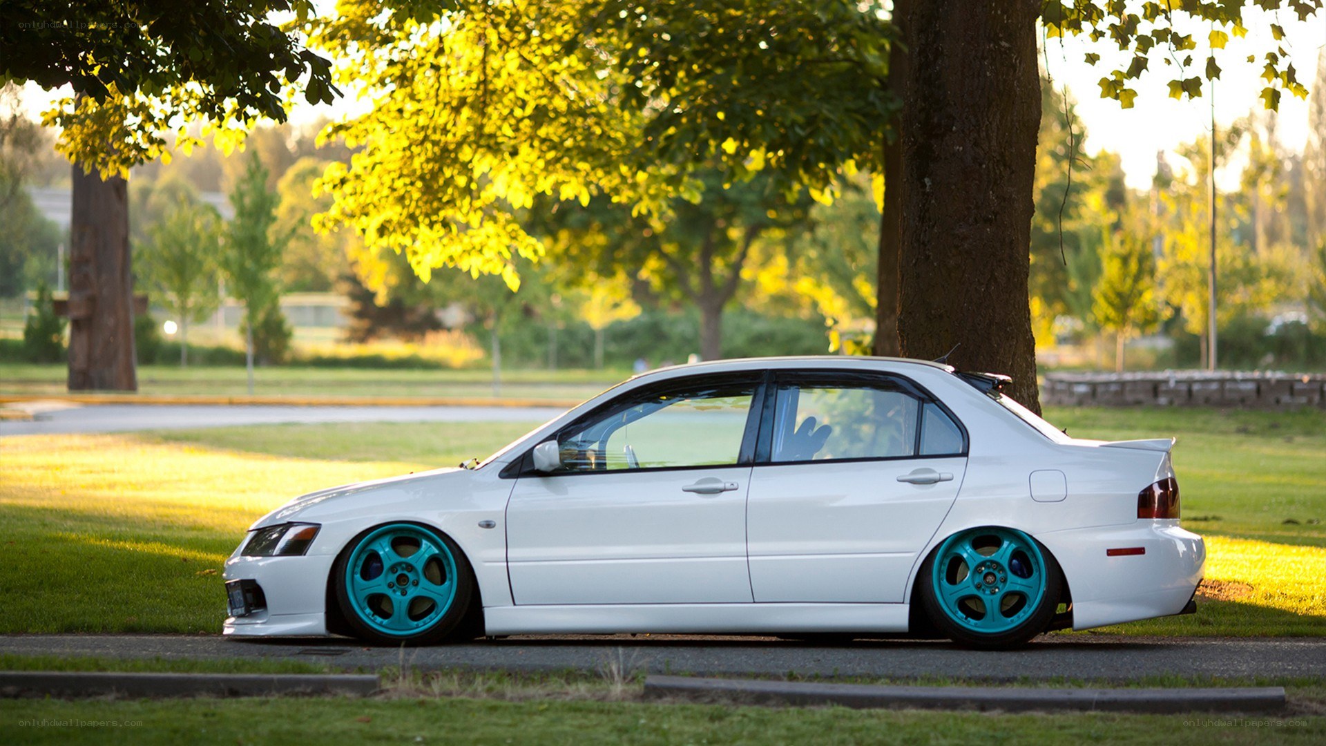 white car with blue wheels