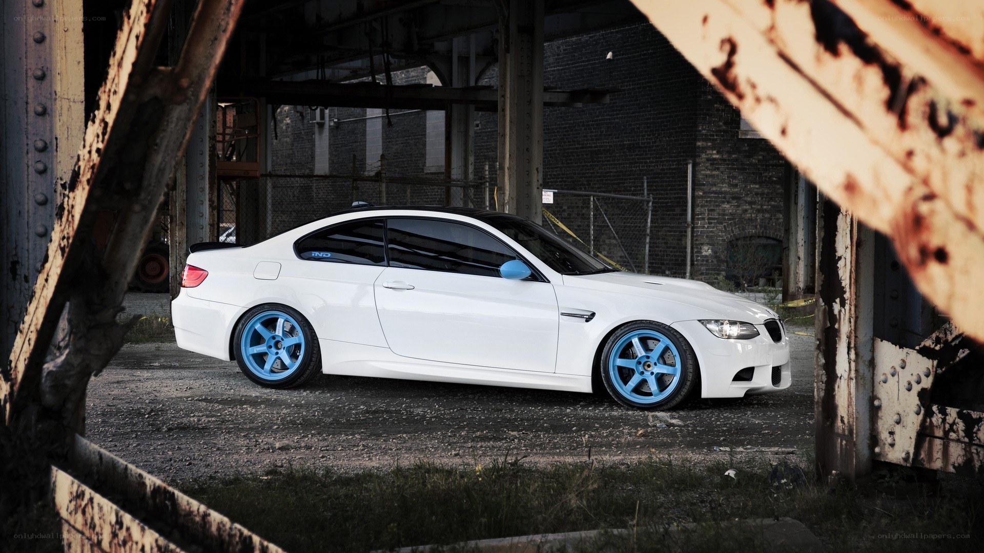 white car with blue wheels