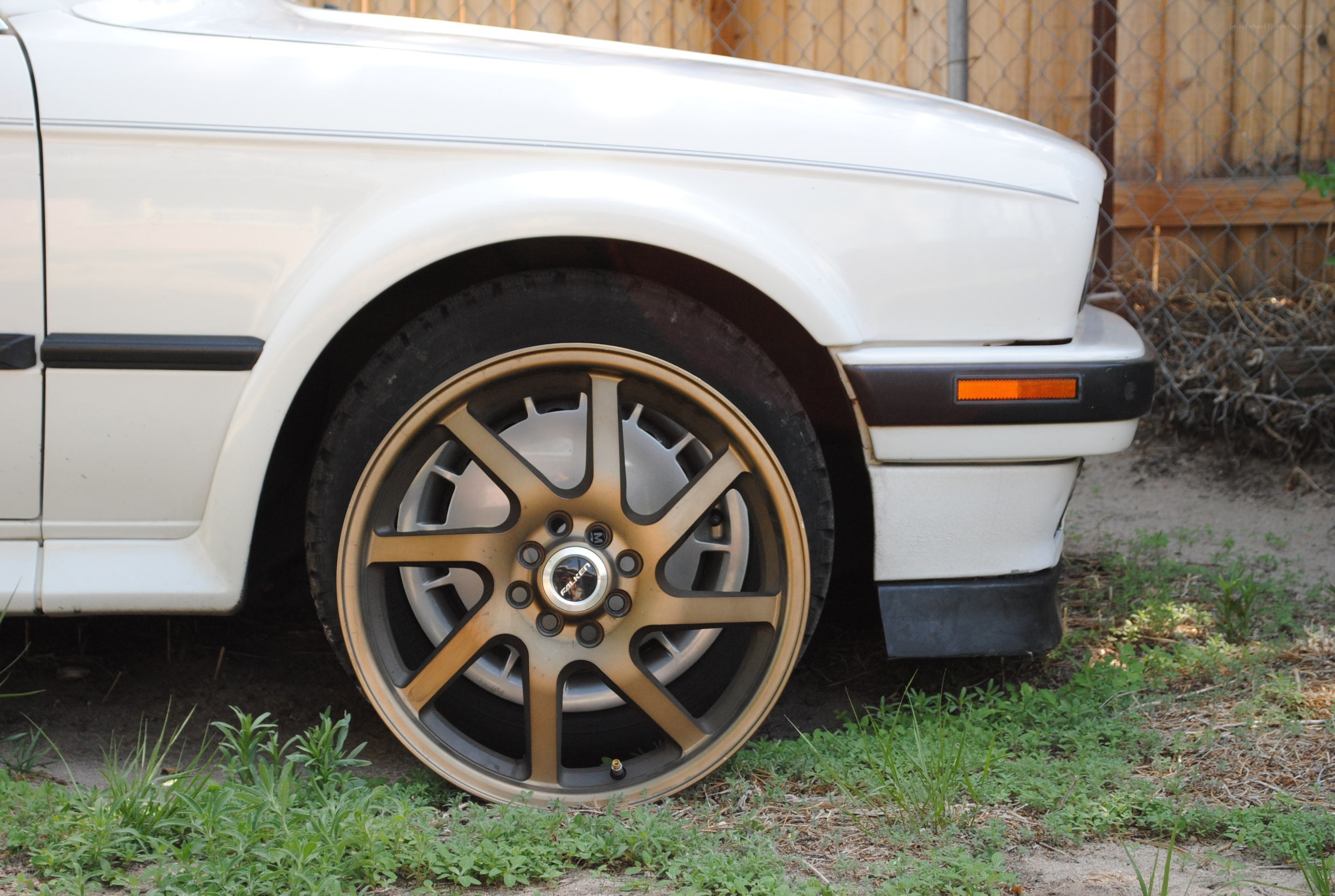white car with bronze wheels