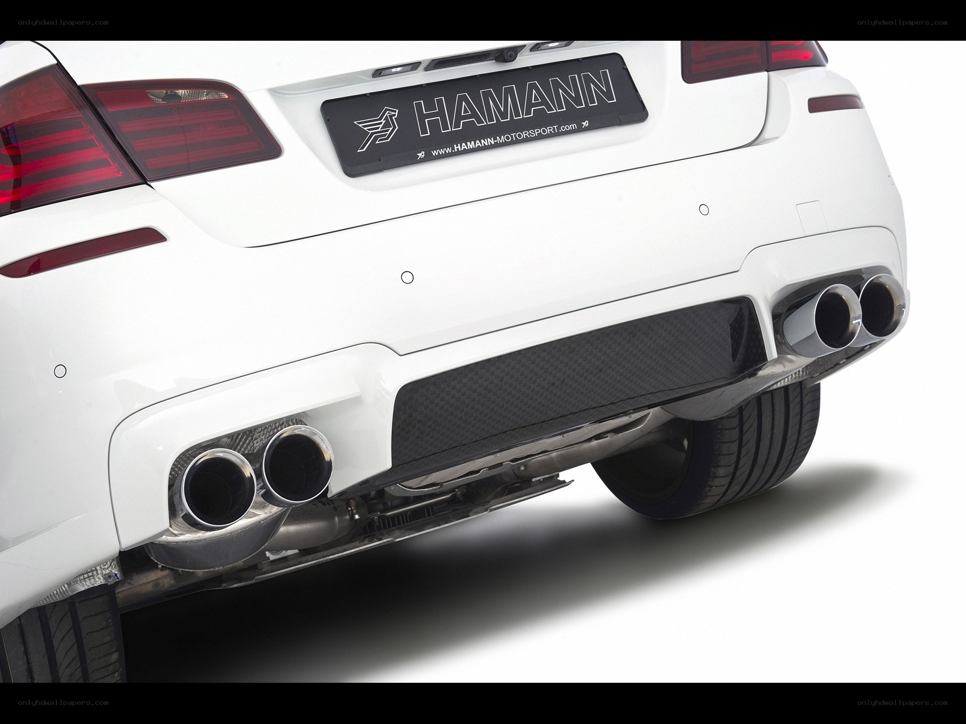 white car with exhaust