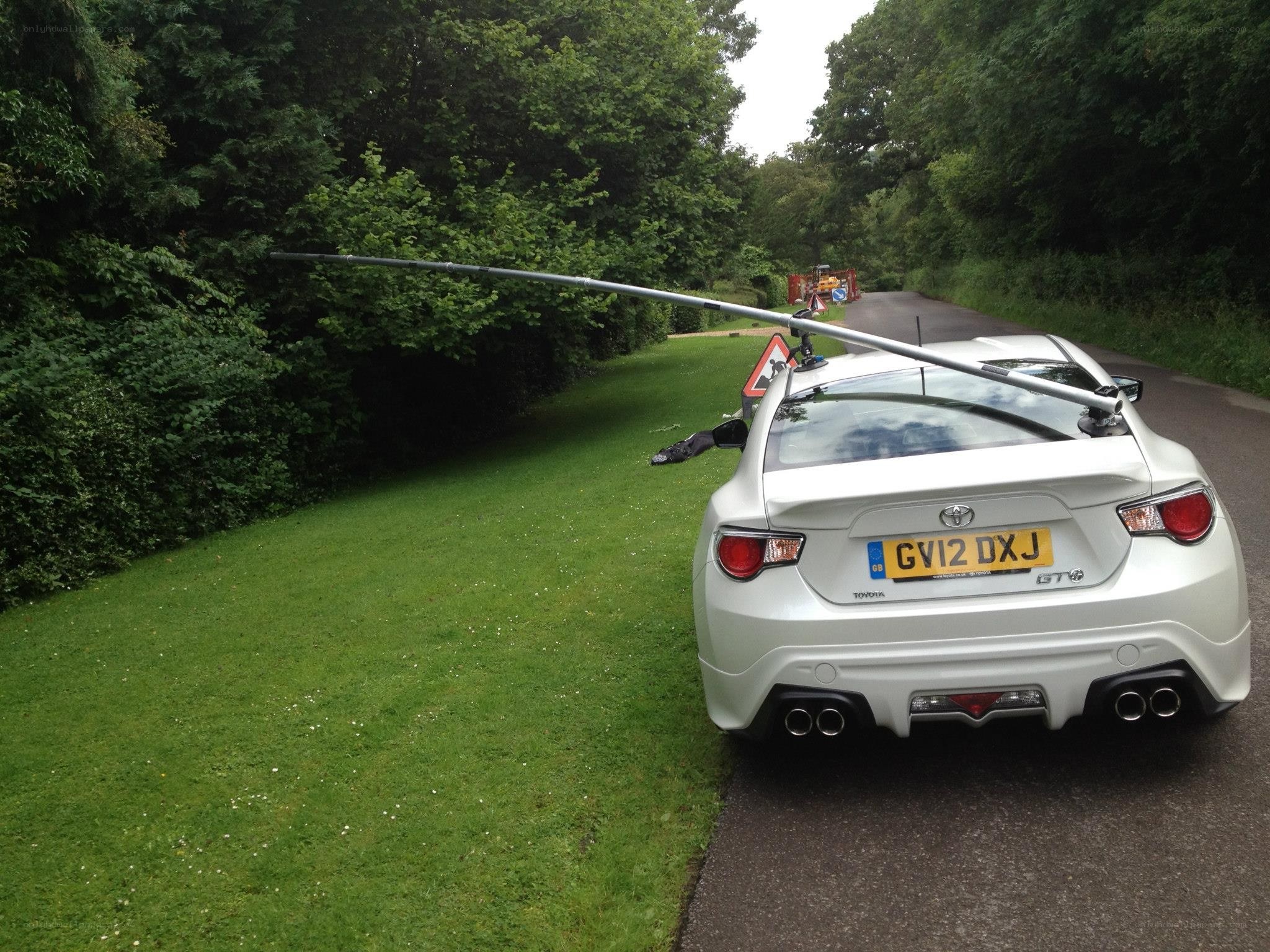 White car with extended antenna