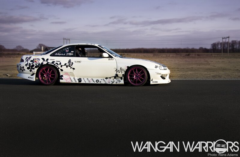 white car with floral decals