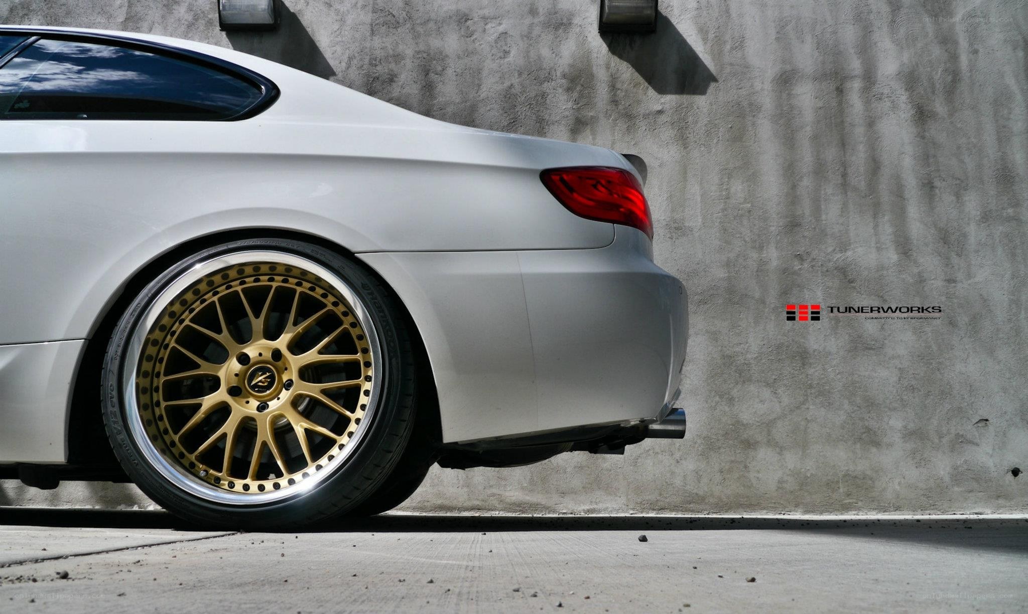 white car with gold wheels