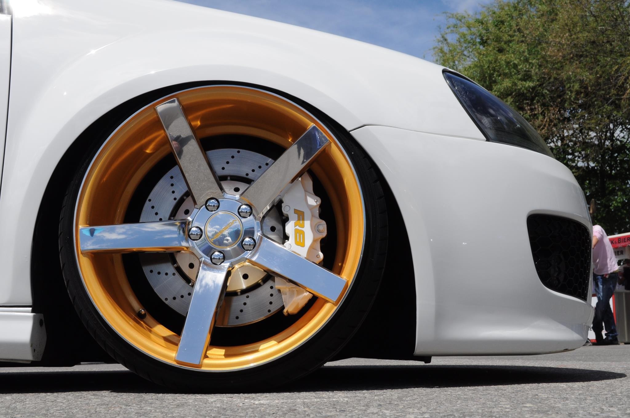 white car with gold wheels
