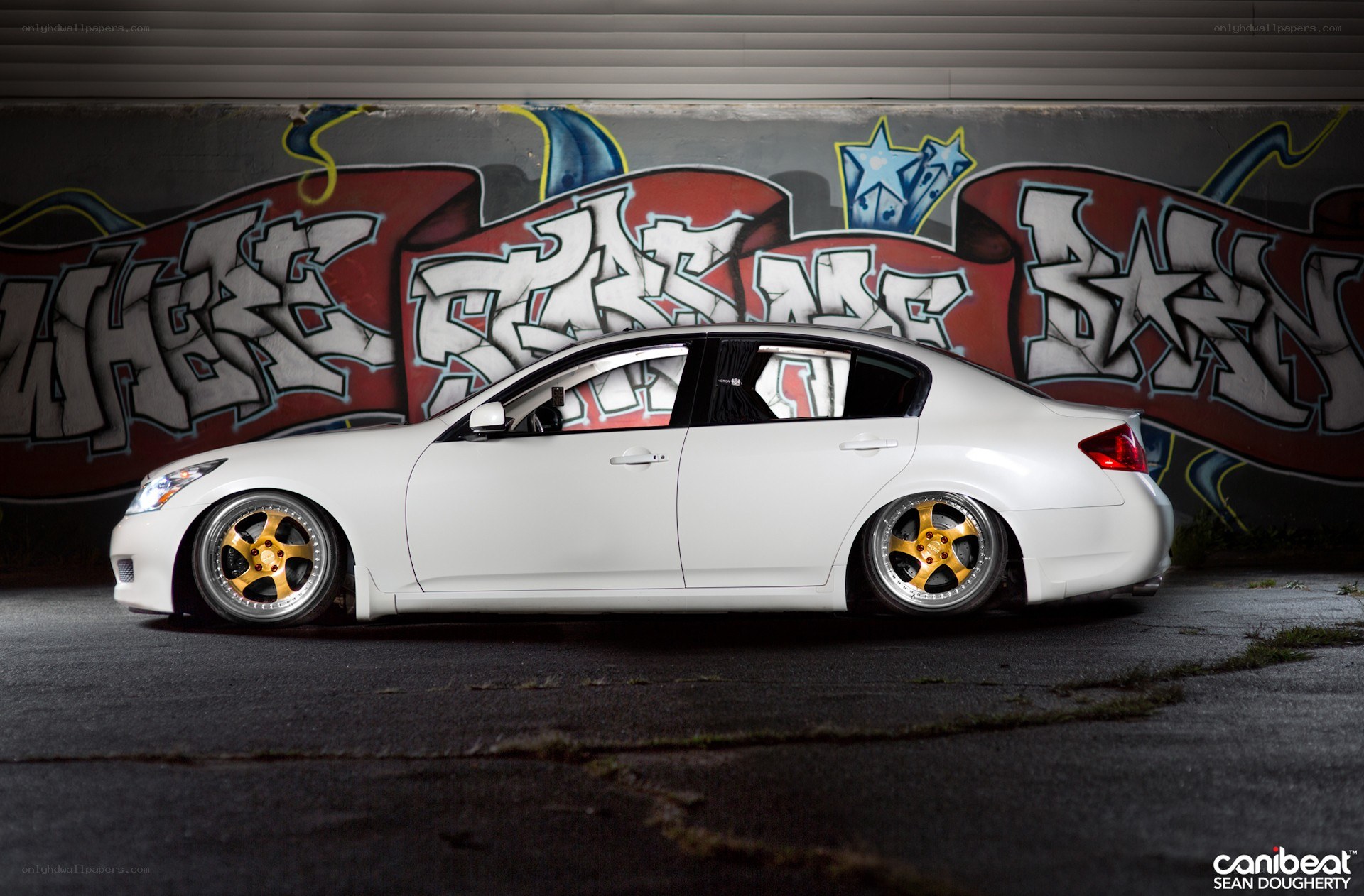 white car with gold wheels