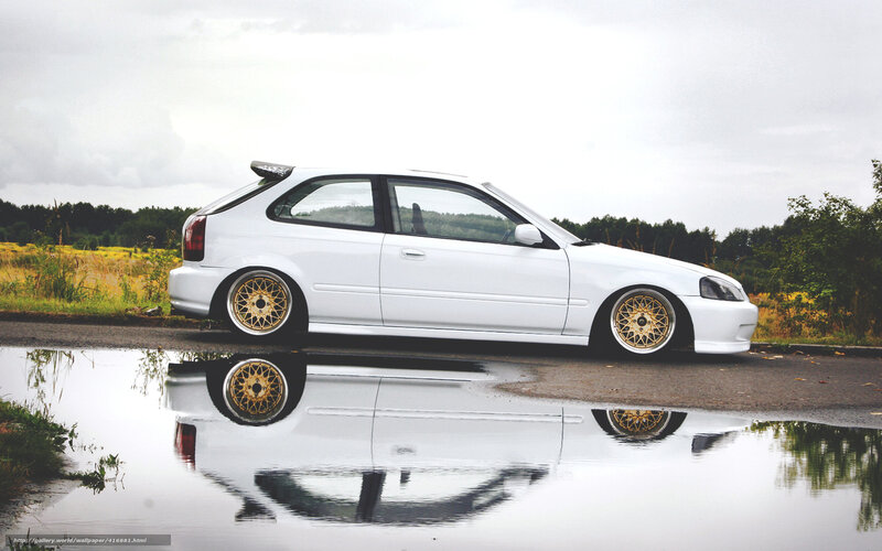 white car with gold wheels