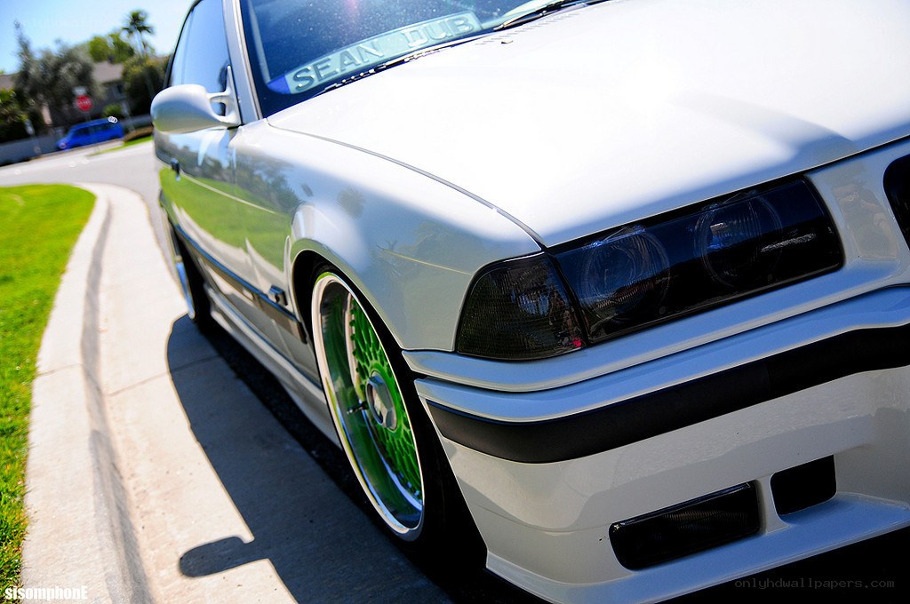 white car with green wheels