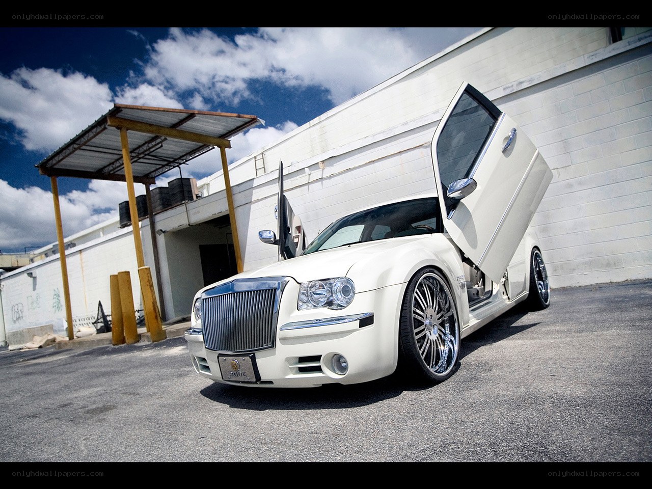 white car with gullwing doors