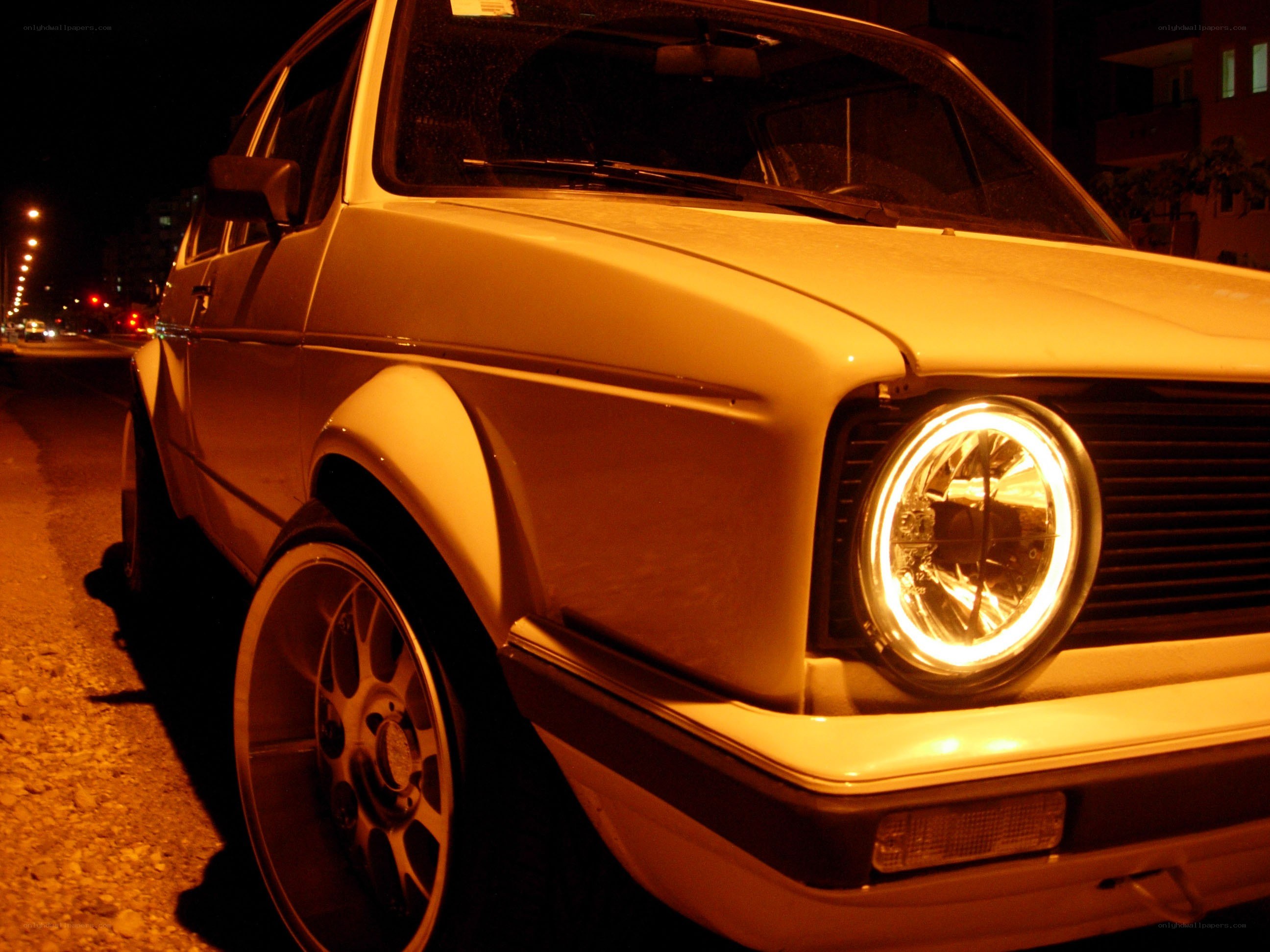 white car with halo headlights
