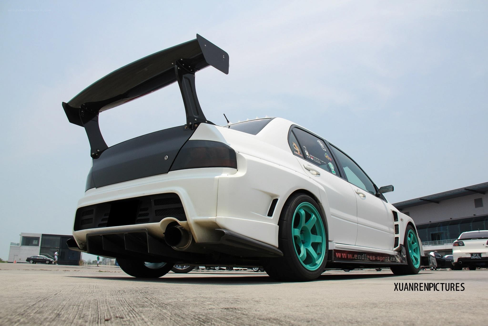white car with large rear wing