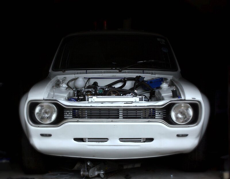 white car with open hood