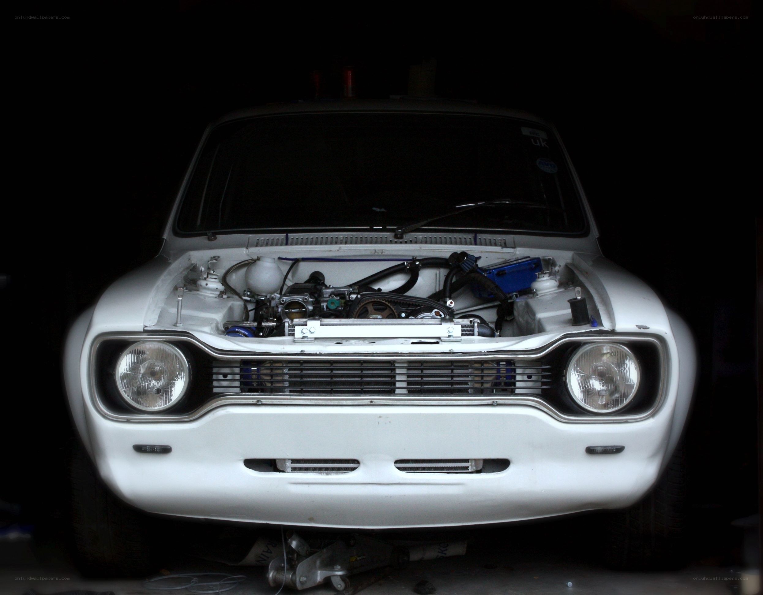 white car with open hood