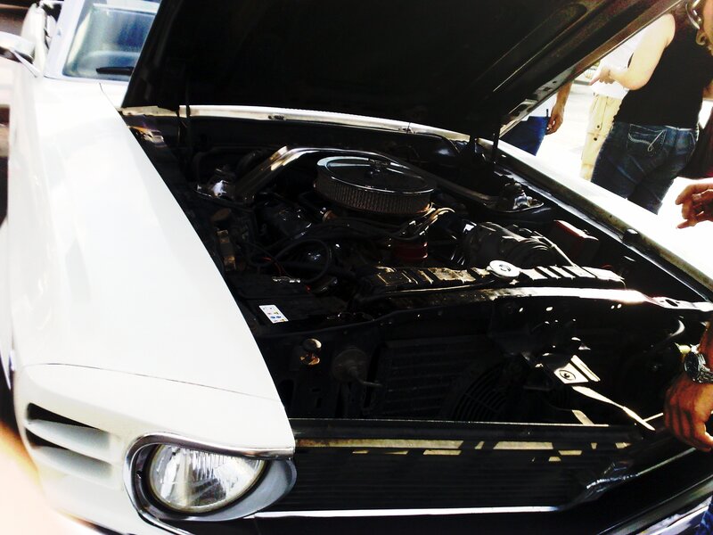 white car with open hood
