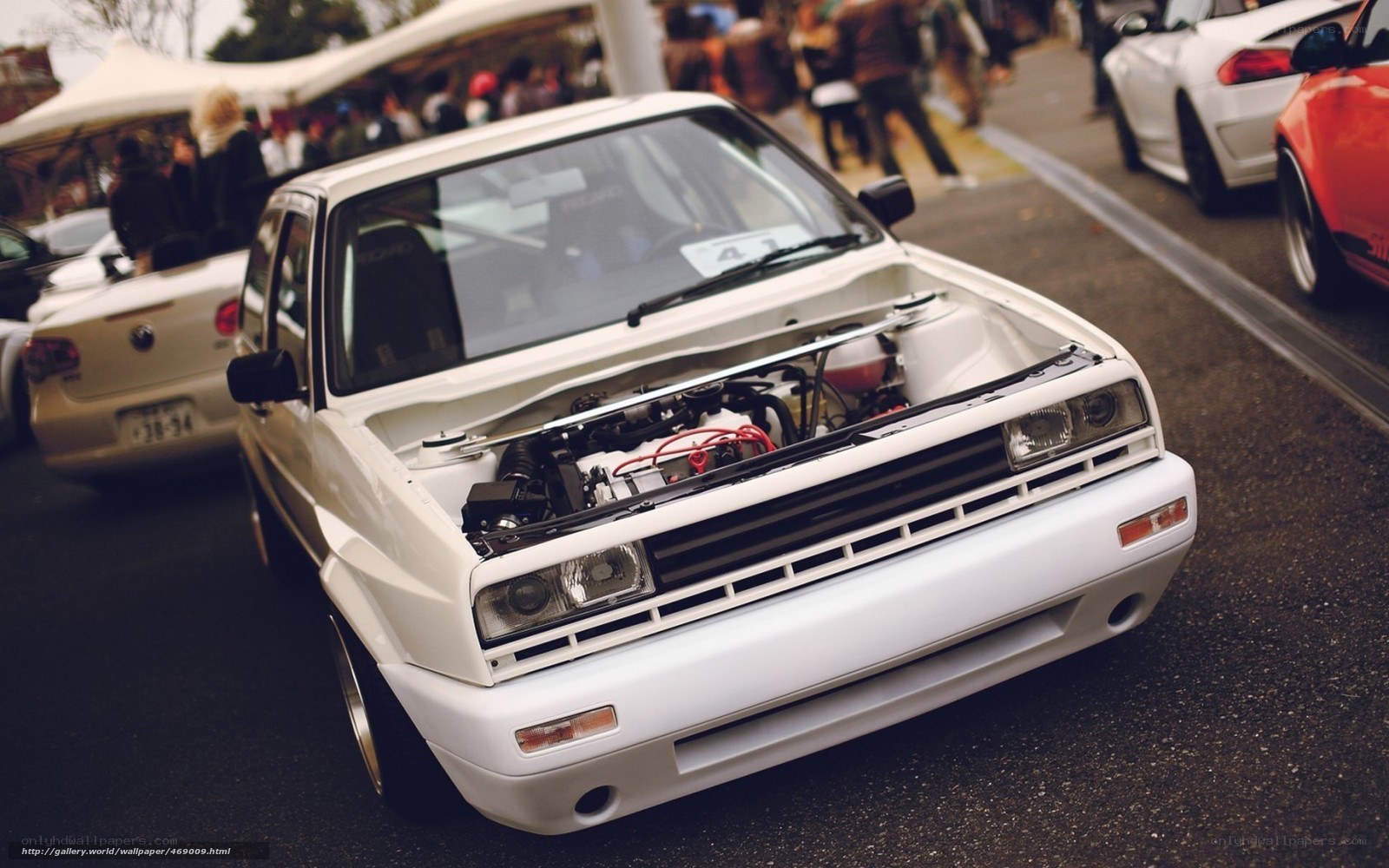 white car with open hood