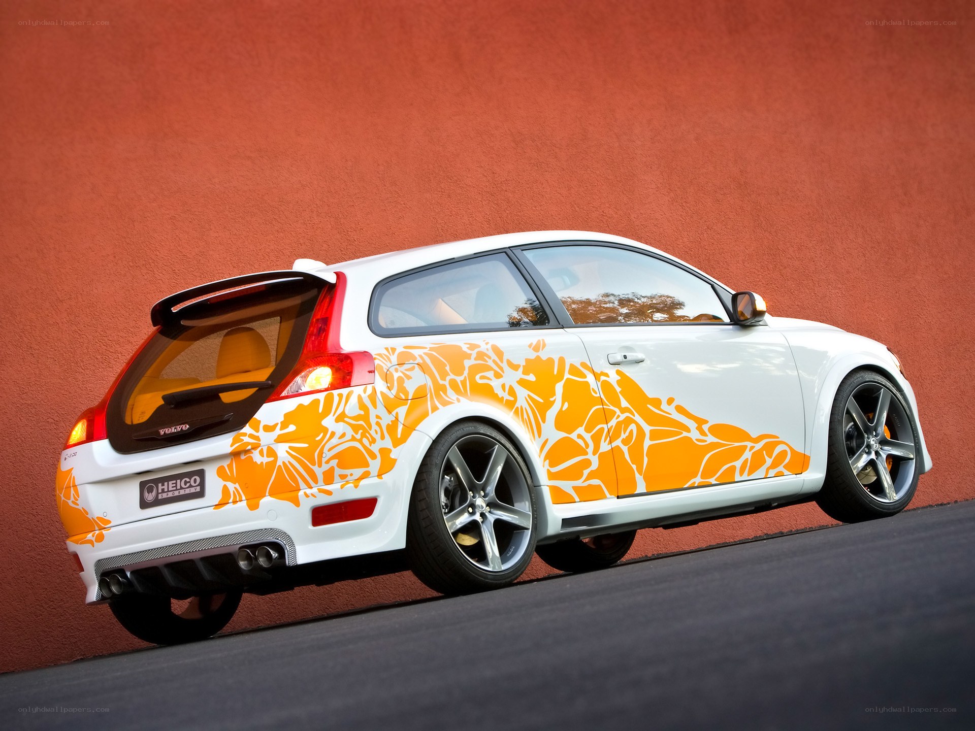 white car with orange graphics