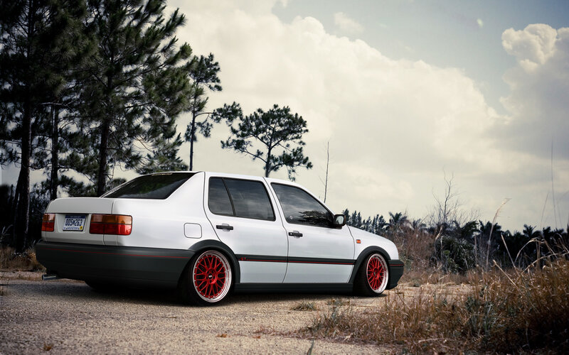 white car with red wheels