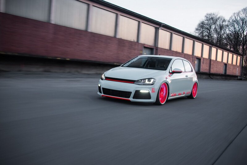 white car with red wheels