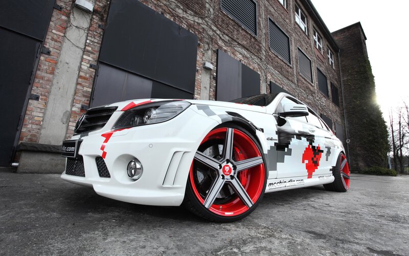 white car with red wheels