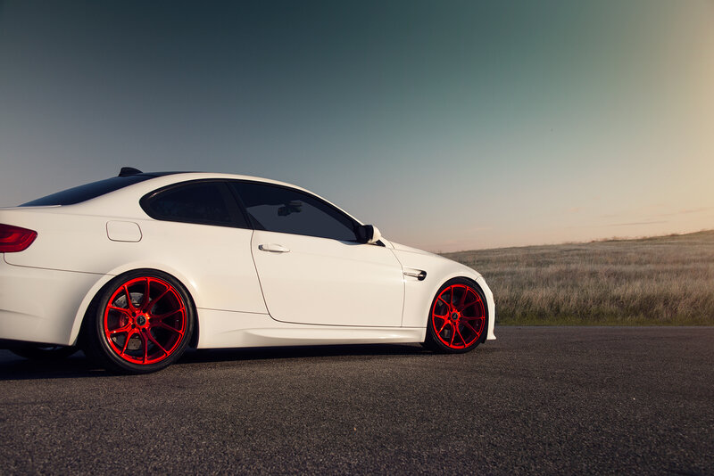 white car with red wheels